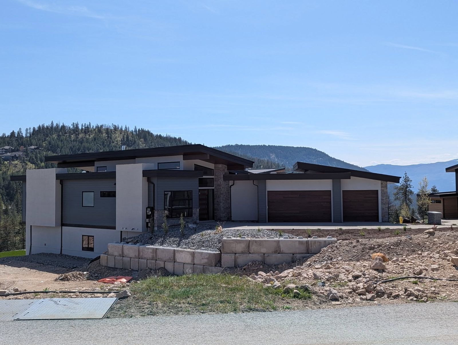 Home on a hillside with a new roof
